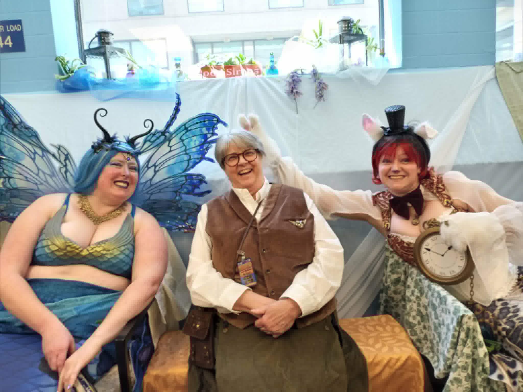 Nan between the queen of mermaids on the left and the rabbit with a clock on the right. Taken at Chicago Steampunk Expo 2026